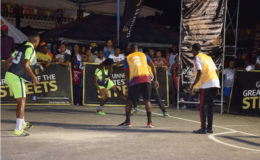 Joel McKennon (2nd from left) of Magics battling for possession of the ball against a  Retrieve Unknowns player during their team’s matchup in the Linden Guinness of the Streets at the Mackenzie Market Tarmac.