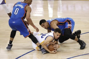 Golden State Warriors guard Stephen Curry (30) gains control of a loose ball next to Oklahoma City Thunder guard Andre Roberson (21) and guard Russell Westbrook (0) in the third quarter in game two of the Western conference finals of the NBA Playoffs at Oracle Arena. Mandatory Credit: Cary Edmondson-USA TODAY Sports