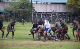 Game action involving the Green Machine and the Reggae Ruggers yesterday at the National Park. Guyana recorded a 23-6 victory. 