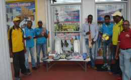 Representatives of Regal Sports and Rawle’s Communication Agency with the sports equipment donated.
.
