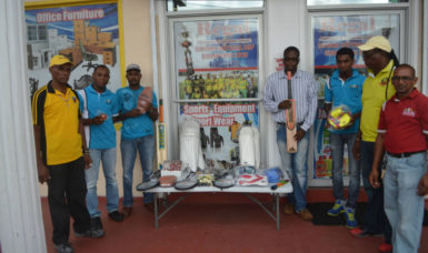 Representatives of Regal Sports and Rawle’s Communication Agency with the sports equipment donated. . 