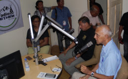 Minister of Communities, Ronald Bulkan speaking on the first radio programme after the launch, along with Minister of Indigenous People’s Affairs, Sydney Allicock (centre) and Minister of Public Communications, Cathy Hughes.