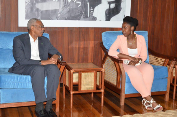 Harvard-bound US-based Guyanese student Kelly Hyles chatting with President David Granger yesterday during a meeting at his office. Hyles’s acceptance to 21 colleges across the United States, including all eight Ivy League schools, had spread across social media like wildfire last month. (See centre pages) 