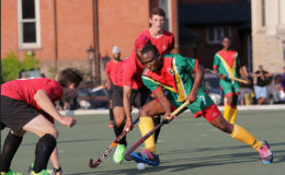 Guyana’s Aroydy Branford (centre) battling to maintain possession while being challenged by several Canadian players during their matchup in the Pan American Junior Championships. Please use this pix on the back page