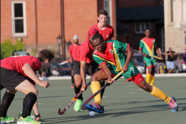 Guyana’s Aroydy Branford (centre) battling to maintain possession while being challenged by several Canadian players during their matchup in the Pan American Junior Championships. Please use this pix on the back page
