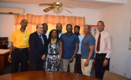National triple jump record holder, Troy Doris (fourth from right) pose for a photo along with members of his family, GOA head, K Juman-Yassin, AAG president, Aubrey Hutson and Chef-De-Mission, Garfield Wiltshire.
