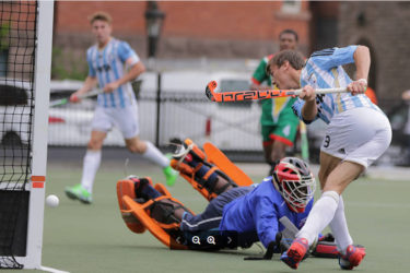 Guyana custodian Medroy Scotland dives in despair to try and stop an Argentina conversion during their match yesterday at the University of Toronto playing surface. 