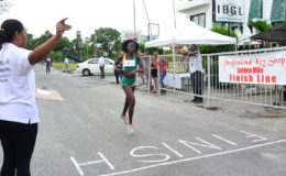 Claudrice McKoy about to cross the line to take the spoils on the distaff side of the inaugural ‘Professional Key Shop and Wind Jammer Hotel Golden Mile’. (Orlando Charles photo)