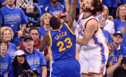 Draymond Green of the Golden State Warriors attempts to block the dunk attempt of Oklahoma Thunder’s Steve Adams.