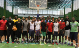 Members of the shortlisted Boys u-16 squad posing with members of the coaching staff following a training session at the Cliff Anderson Sports Hall.