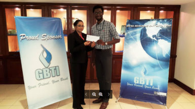 In Picture: Marketing Manager Ms. Pamela Binda and GLTA’s President Jamal Goodluck with the sponsorship cheque.  