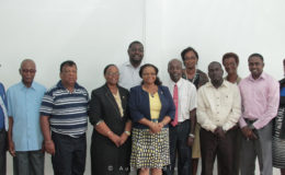 Minister of Social Protection, Volda Lawrence (fifth from left in front row) with committee members.