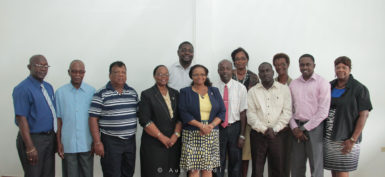 Minister of Social Protection, Volda Lawrence (fifth from left in front row) with committee members. 