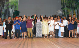 From left:  Sita Nagamootoo, Prime Minister Moses Nagamootoo, Natasha Lewis from the Ministry of Social Cohesion, Minister of Social Cohesion,  Amna Ally and First Lady,  Sandra Granger with the performers from the 'One' production, last evening at the National Cultural Centre