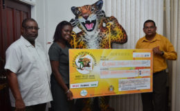 GAICO Construction and General Services’ Representative, Francesca Peters (centre) presents a $500,000 cheque to Guyana Tourism Authority’s Director, Indranauth Haralsingh (right) and Permanent Secretary to the Ministry of Public Telecommunications, Derrick Cummings. (GINA photo)