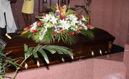 The body of the late Tony Cozier lies in the chapel of the Coral Ridge Memorial Gardens on Friday.
