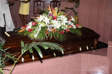 The body of the late Tony Cozier lies in the chapel of the Coral Ridge Memorial Gardens on Friday.