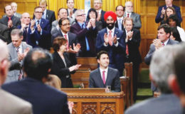 Canada’s Prime Minister Justin Trudeau (seated) receives a standing ovation after delivering a formal apology for the Komagata Maru incident in the House of Commons on Parliament Hill in Ottawa, Canada yesterday. Reuters/Chris Wattie
