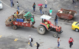 A Mayor and City Council tractor taking away the stalls from Stabroek Square