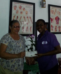 Sports Masseuse, Kathleen Paul handed over a gift certificate to Committee Member of the Powerlifting federation, Andrea Smith recently. 