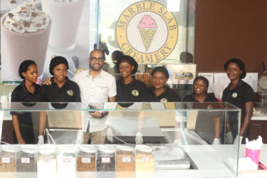Marketing Manager of Marble Slab Creamery, Navin Singh, posing with other Marble Slab employees at their launching yesterday.
