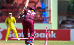 West Indies opener Johnson Charles is bowled all ends up by Mitchell Starc during Match 2 of the Ballr Cup Tri-Nation Series between West Indies and Australia at Guyana National Stadium, Providence yesterday. Photo by WICB Media/Randy Brooks of Brooks Latouche Photography
