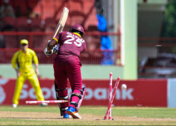 West Indies opener Johnson Charles is bowled all ends up by Mitchell Starc during Match 2 of the Ballr Cup Tri-Nation Series between West Indies and Australia at Guyana National Stadium, Providence yesterday. Photo by WICB Media/Randy Brooks of Brooks Latouche Photography 