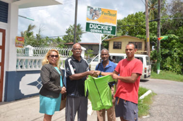 Florida based Victor Rutherford (left) who is the coordinator of the GCANA, yesterday handed over the kits to Vice President of the Guyana Cycling Federation (GCF), Paul Choo-Wee-Nam in the presence of GCF’s Gemma Williams and William Howard.