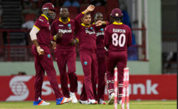 Some West Indies players celebrate the fall of  a wicket during Match 2 of the Ballr Cup Tri-Nation Series between West Indies and Australia at Guyana National Stadium, Providence on Sunday. Photo by WICB Media/Randy Brooks of Brooks Latouche Photography
