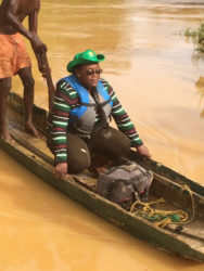Junior Natural Resources Minister Simona Broomes crossing the Konwaruk  River on her way to the backdam 