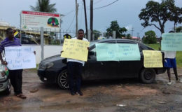 Contractor in mini protest outside the Region Six Regional Democratic Council office 