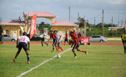 Action between Vreed-en-Hoop Secondary (white) and L’Aventure Secondary in the West Demerara leg when the 6th edition of the Digicel National  U18 Secondary Schools Football Championship started at the Leonora Sports Facility.
