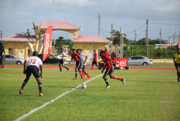 Action between Vreed-en-Hoop Secondary (white) and L’Aventure Secondary in the West Demerara leg when the 6th edition of the Digicel National U18 Secondary Schools Football Championship started at the Leonora Sports Facility. 
