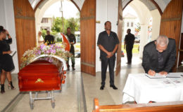 President David Granger signing the book of condolence for Jules Kranenburg at the Cathedral of the Immaculate Conception, Brickdam, Stabroek. (Ministry of the Presidency photo)
