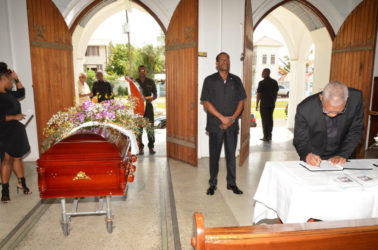 President David Granger signing the book of condolence for Jules Kranenburg at the Cathedral of the Immaculate Conception, Brickdam, Stabroek. (Ministry of the Presidency photo) 