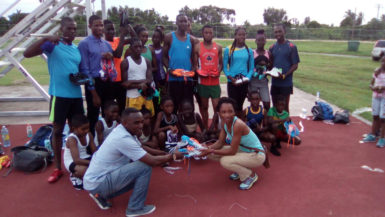 Some of the Running Brave Athletic Club (RBAC) athletes pose with their Adidas and Nike spikes presented by former national 800 and 1500m athlete, Robin Bishop. 