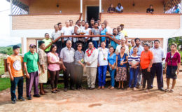 Prime Minister Moses Nagamootoo (front, centre) along with Minister within the Ministry of Indigenous Peoples’ Affairs Valerie Garrido-Lowe and Minister of  Indigenous Peoples’ Affairs Sydney Allicock flanked by  representatives of the region and the newly trained facilitators of the Hinterland Employment Youth Service  (HEYS) programme. 