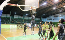 GTI’s Roger John in the process of dunking against the Bishops’ High during their u-19 quarterfinal matchup at the Cliff Anderson Sports Hall.