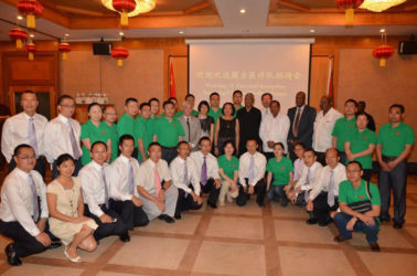 The outgoing Chinese Medical Brigade and their successors with government officials and representatives of the Chinese embassy. (Ministry of the Presidency photo)    