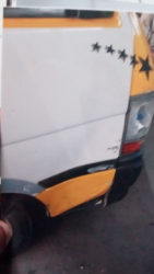 The damaged driver side bus door. 