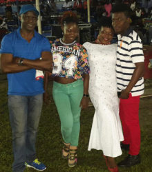 T'shanna Cort (second, right) after winning the Junior Calypso Competition with designer Nelsion Nurse (right) and her mentors Burchmore Simon (left) and Melissa 'Vanilla' Roberts 