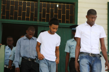 Leaving the courtroom, from left to right: Dameion Millington, Nicolas Narine and Warren McKenzie after they were found guilty by Magistrate Zamilla Ally-Seepaul in the robbery of Justice Nicola Pierre and her husband Mohamed Chan.