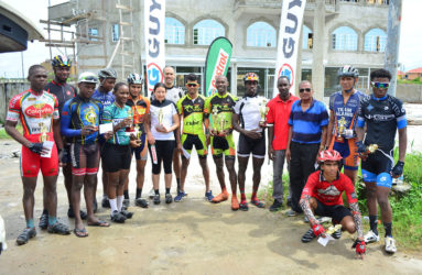 Winner Row! The prize winners pose with their spoils following the staging of the 17th annual Castrol Father’s Day road race yesterday at West Demerara. (Orlando Charles photo) 