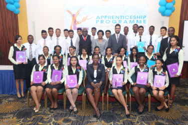 Minister within the Ministry of Education Nicolette Henry (front, centre) flanked by the successful graduates of the Republic Bank’s Youth Link Apprenticeship Programme and staff of Republic Bank Guyana Limited including Managing Director Richard Sammy.  