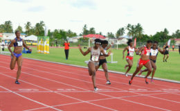 Guyana’s fastest female athlete, Brenessa Thompson (lane 5) on her way to breaking the national 100m record on Saturday at the Aliann Pompey Invitational