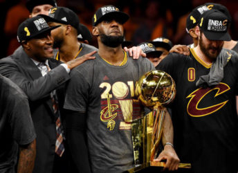 Cleveland Cavaliers forward LeBron James celebrates with the Larry O’Brien Championship Trophy after beating the Golden State Warriors in game seven. (Reuters) 