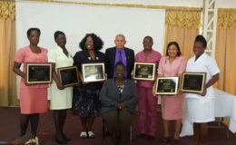 Public Health Minister, Dr. George Norton (standing at centre) with representatives of the six hospitals which attained Baby-Friendly Hospital status. Seated at centre is Senior Nutritionist, Ninian Blair. (Ministry of Public Health photo)
