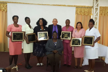 Public Health Minister, Dr. George Norton (standing at centre) with representatives of the six hospitals which attained Baby-Friendly Hospital status. Seated at centre is Senior Nutritionist, Ninian Blair. (Ministry of Public Health photo) 