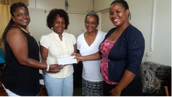 From left are Rebecca Miskiri-Antoine, Delores Collins and Joycelyn Thompson, members of the Baveghems family. Also in picture is Daniella King (right), Assistant Registrar-Students’ Welfare, UG.  