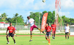 Action between Xenon Secondary (white) and Friendship Secondary in the Digicel Schools Football Championship at the Leonora Sports Facility 